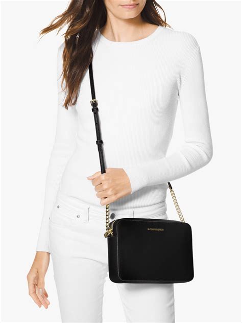 michael kors black bag gold zip|Michael Kors crossbody purse.